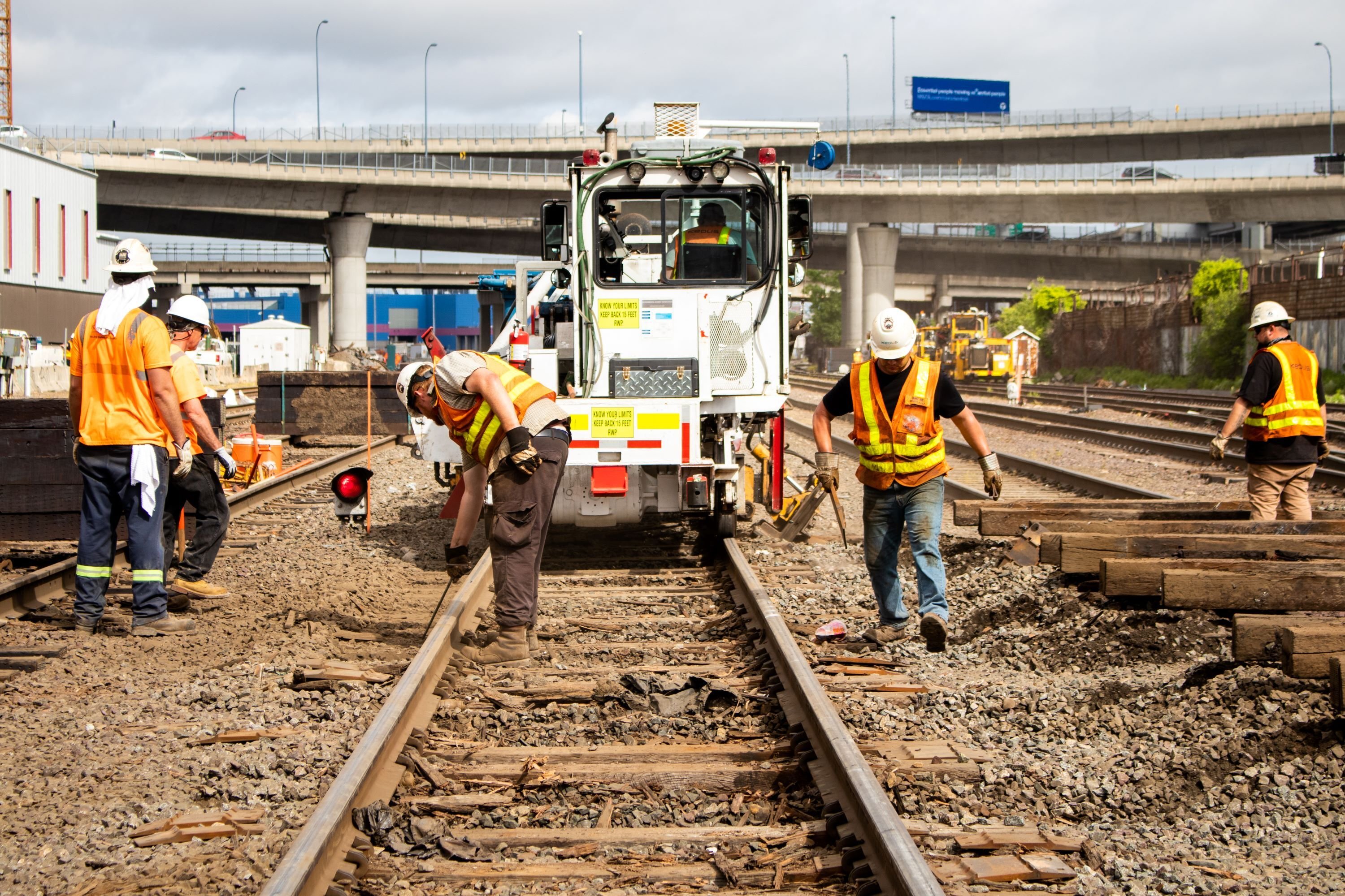 Crews work along Commuter Rail tracks