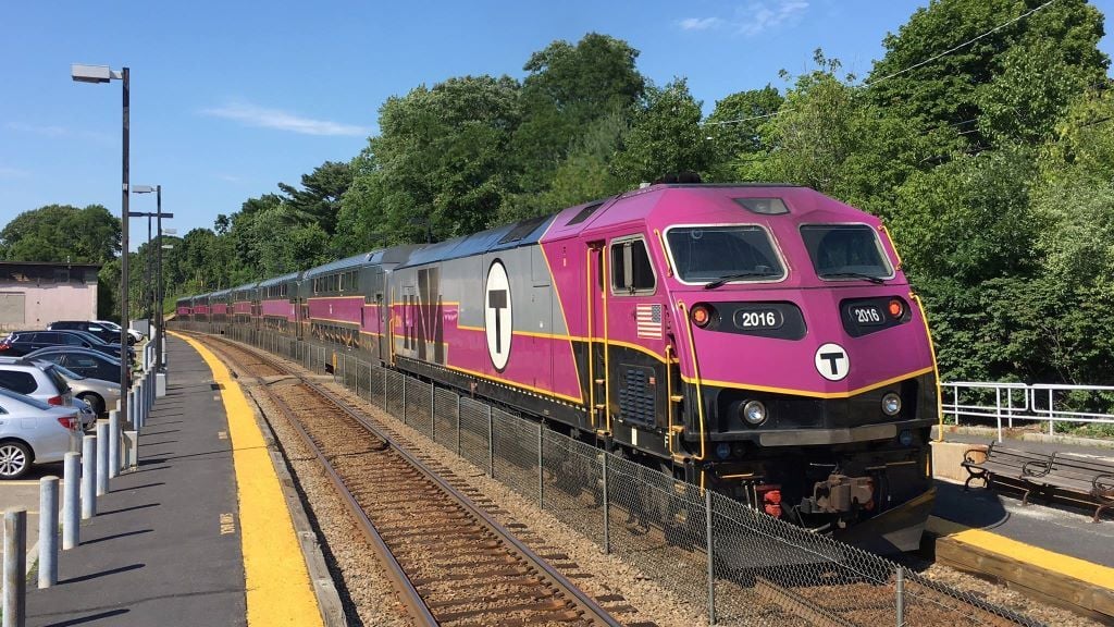 A Commuter Rail train pulls into a station