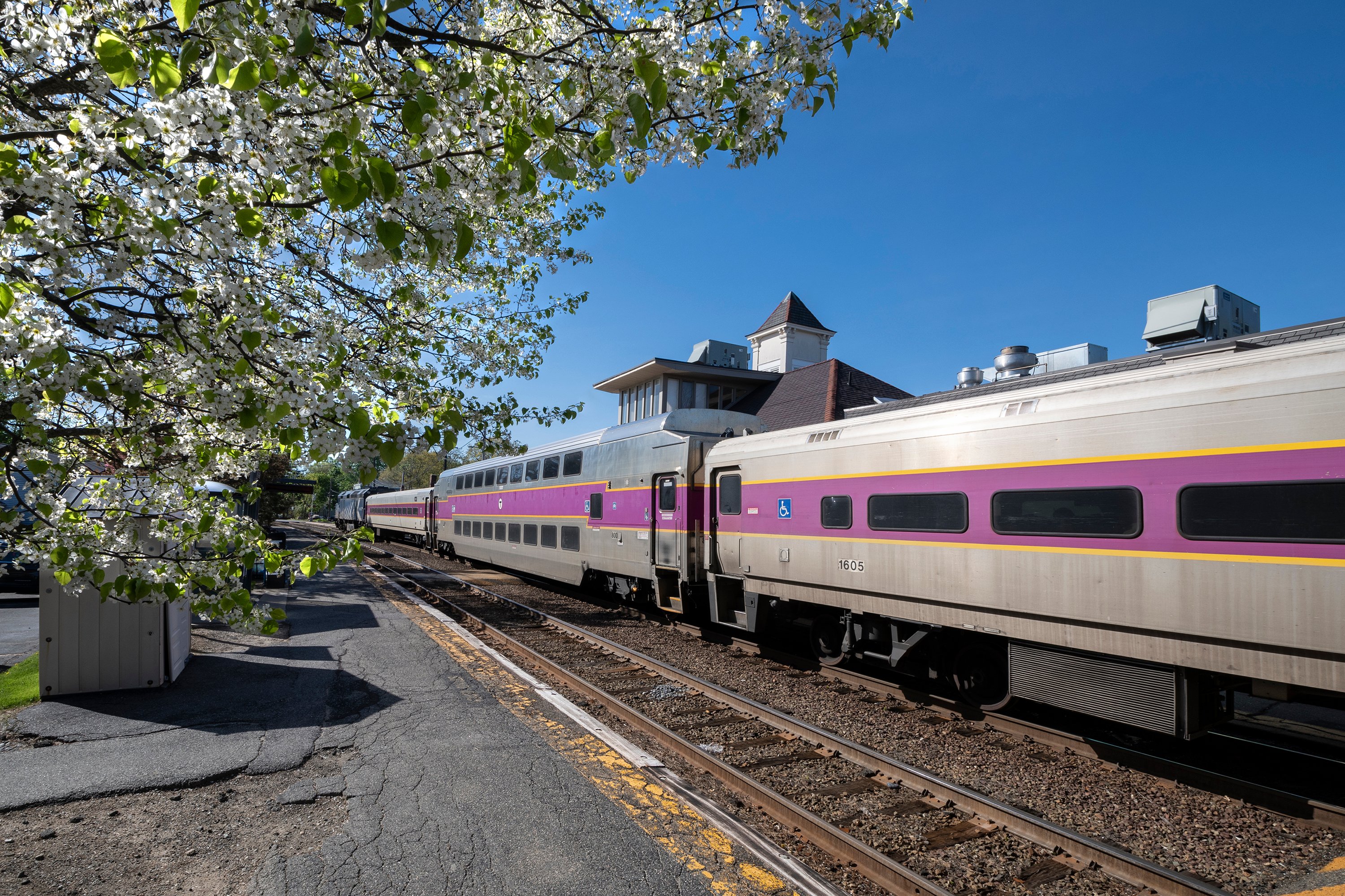 A Commuter Rail train stopped at a station