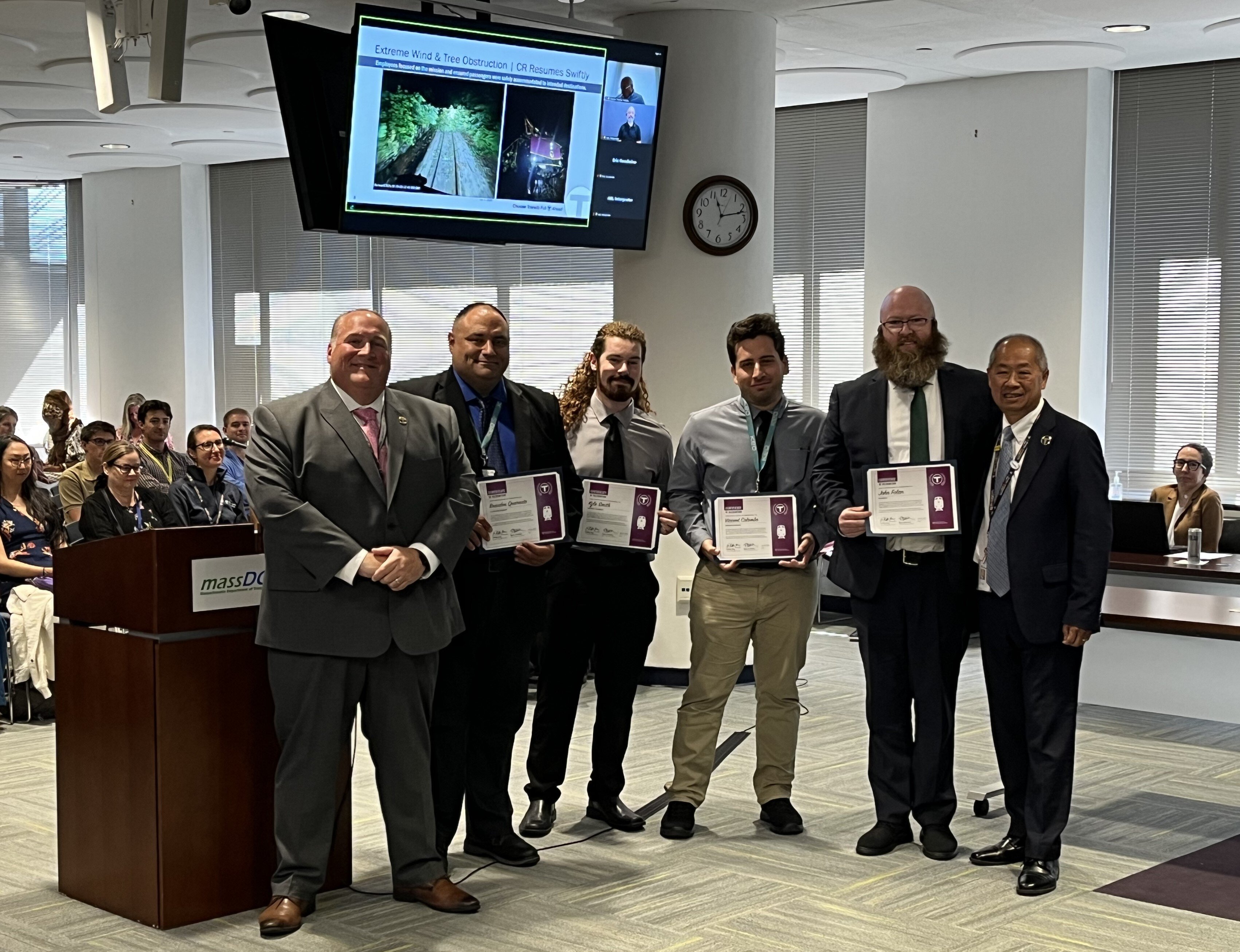 A group of Keolis employees are recognized at an MBTA Board of Directors meeting